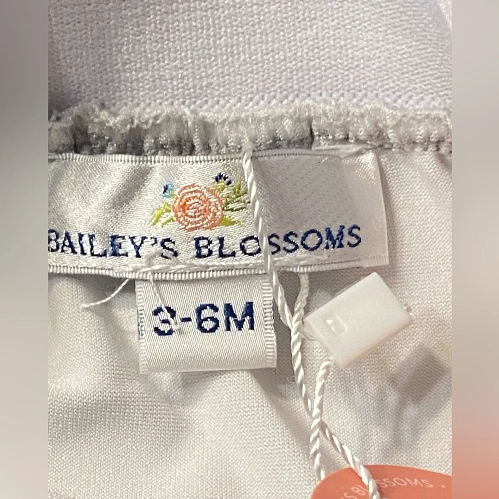 Bailey’s Blossom White ruffled bodysuit top with Sequin Skirt. Size 3–6 months.